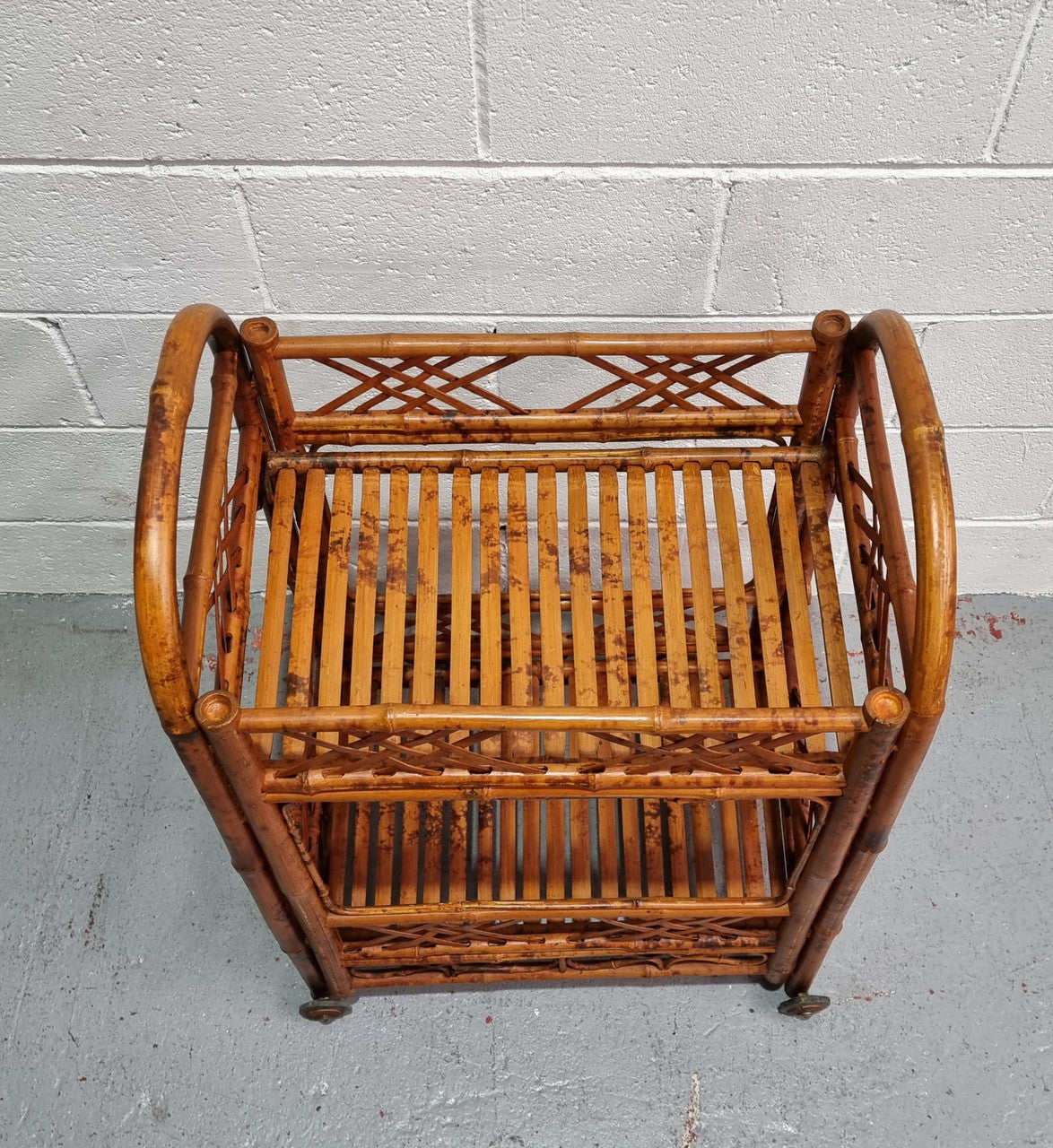 Excellent Vintage Tortoiseshell Bamboo two tier auto trolley. It has been sourced locally and is in fantastic original detailed condition .