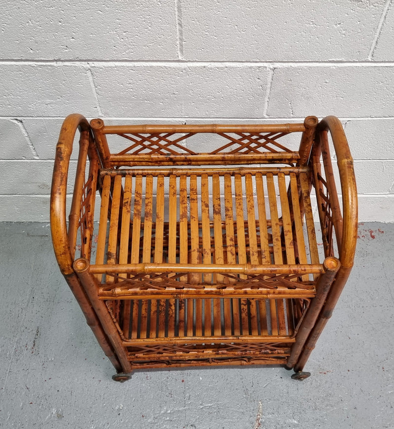 Excellent Vintage Tortoiseshell Bamboo two tier auto trolley. It has been sourced locally and is in fantastic original detailed condition .