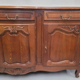 French Oak Louis XV style three drawer three door parquetry top sideboard. It has been sourced from France and is in good original detailed condition.