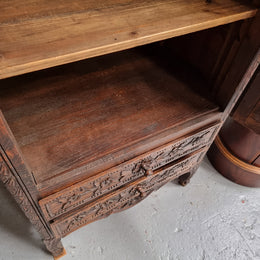 Petite oak armoire display cabinet with a glass door, two drawers at the bottom and three shelves inside. Late 18th Century and amazing detailed decorative carvings. Sourced from France and in good original condition.