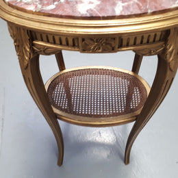 An exceptional & rare 18th century Louis XVI oval inset marble top & giltwood side table with original water gilding. In good restored condition. Circa 1790.