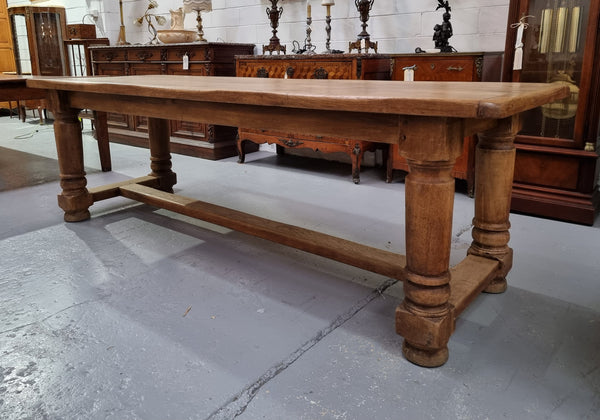 French Oak stretcher base farmhouse table with solid turned legs. It is in good original condition.