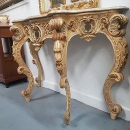 Beautifully carved Italian Rococo style painted console/hall table and mirror. An amazing coloured marble top showing sections of gold veins and is in good condition. Mantle mirror is retaining it's original mirror and showing ages spots.