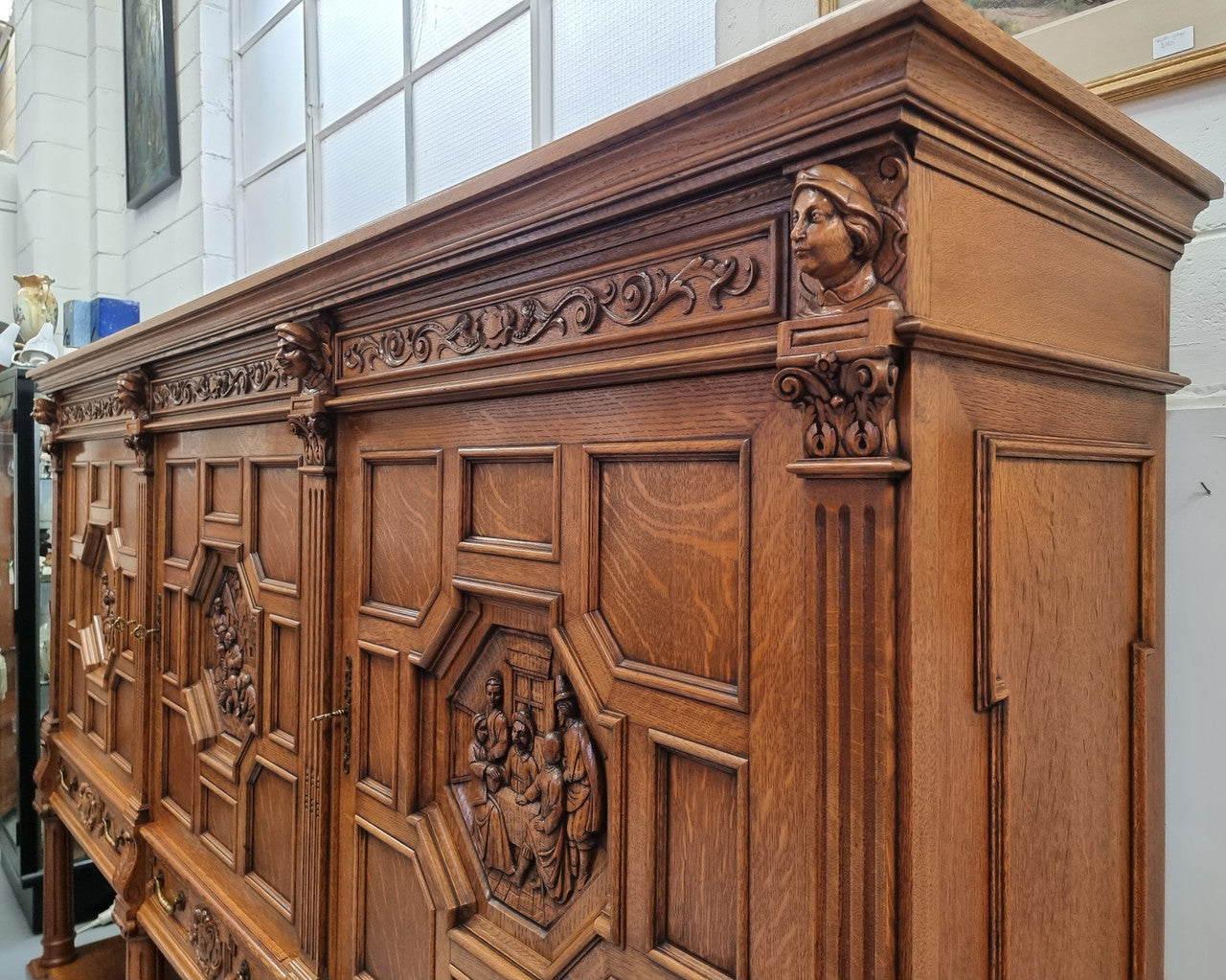 Impressive and grand French Oak Renaissance style sideboard. Beautifully detailed carvings and plenty of storage with three very large cupboards with a total of eight adjustable shelves along with three large drawers. It has been sourced from France and is in very good original detailed condition.