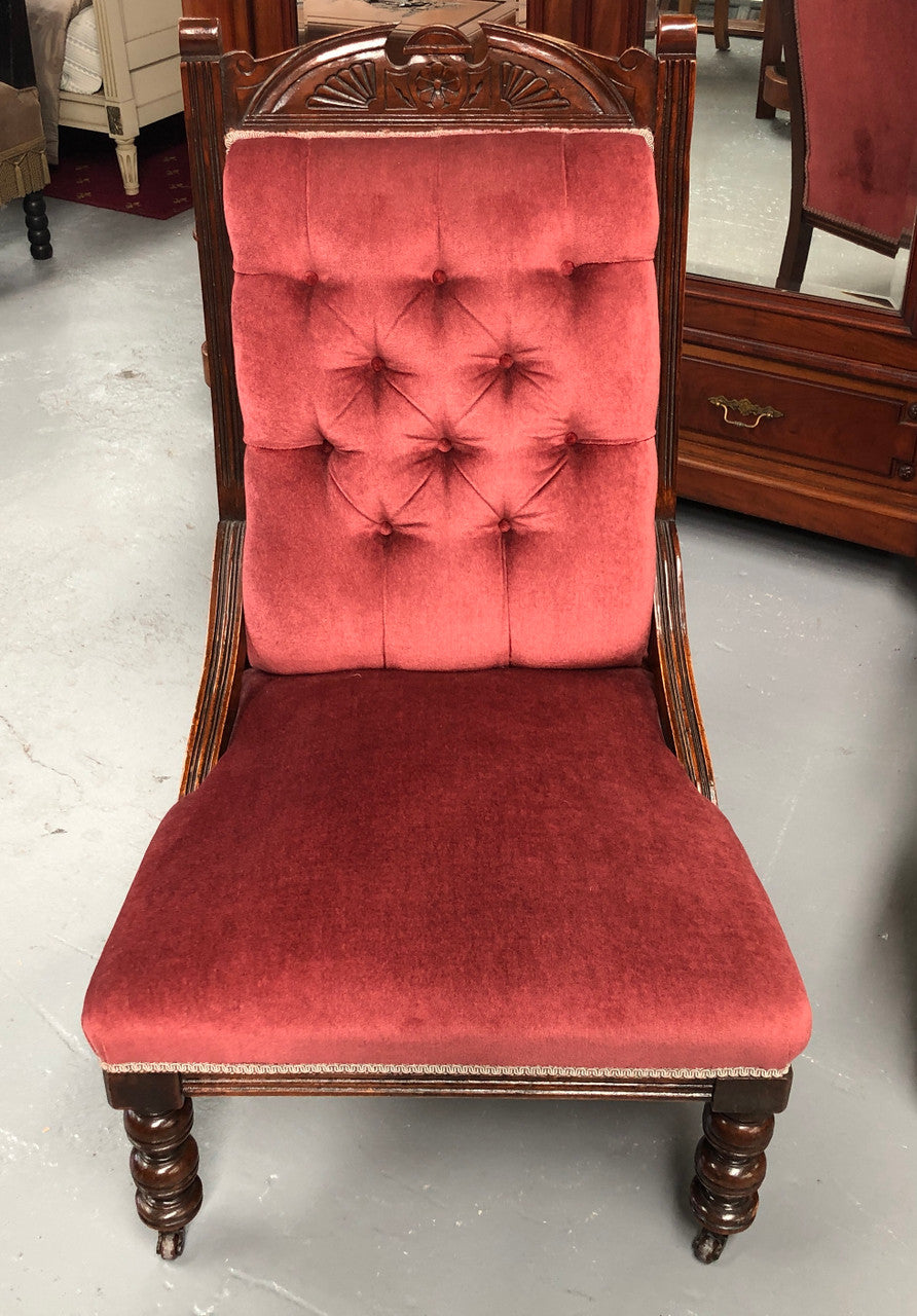 Beautiful pair of carved Edwardian arm chairs with lovely pink upholstery with button backs. In good condition.