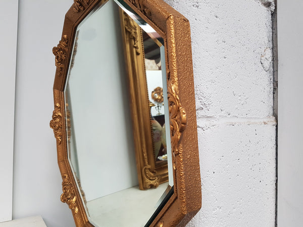 A beautiful Vintage octagon shape ornate gilt mirror, with bevelled glass and in good original condition.