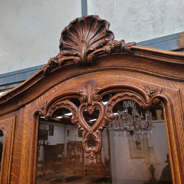 Impressive French Oak Louis 14th Style Display and Sideboard. It has 4 drawers, 2 bottom cupboards with 6 total shelves and 3 display doors with 3 shelves.  In good, detailed condition.