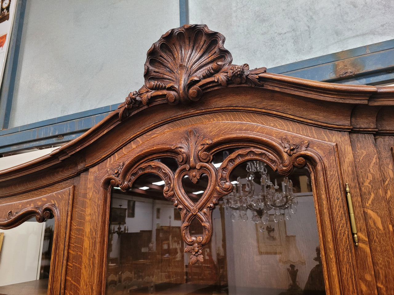 Impressive French Oak Louis 14th Style Display and Sideboard. It has 4 drawers, 2 bottom cupboards with 6 total shelves and 3 display doors with 3 shelves.  In good, detailed condition.