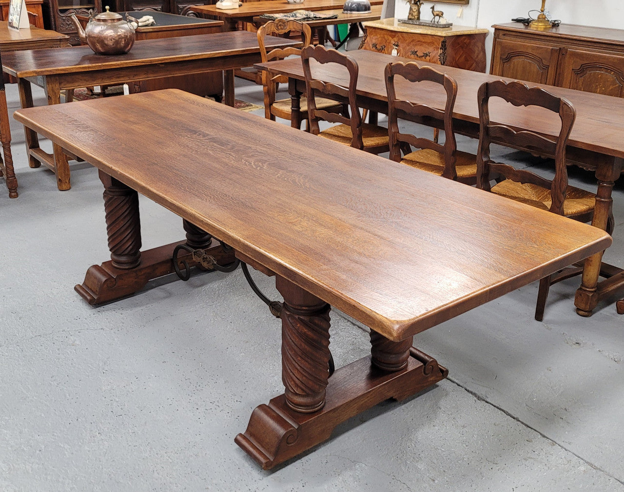 Amazing French Oak Spanish Renaissance style dining table with beautiful decorative iron work. It has been sourced from France and can comfortable seat 8- 10 people. Sourced from France and is good original detailed condition.