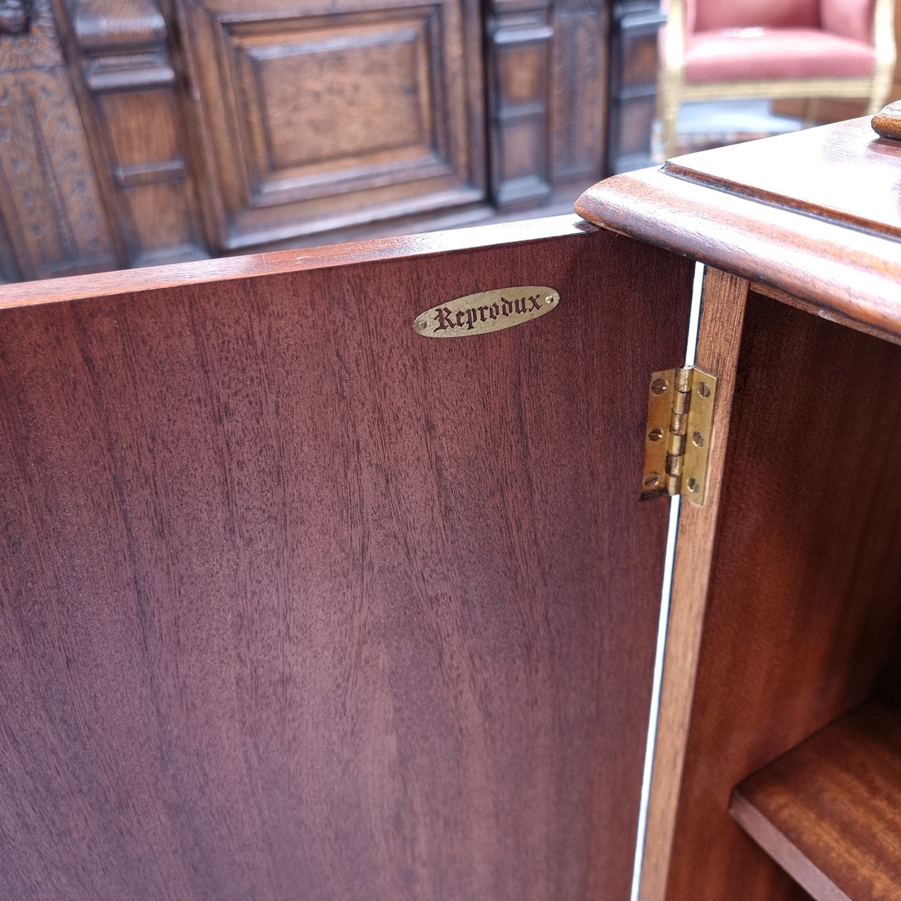Georgian style Breakfront Flame Mahogany four door bookcase. A very impressive piece with plenty of storage and is of pleasing narrow proportions. It has been sourced locally and is in good original detailed condition.