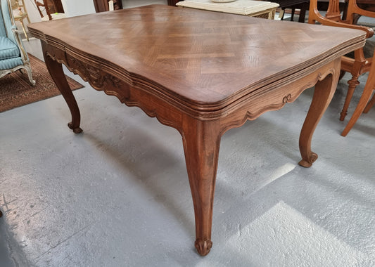 Oak Louis 15th style parquetry top extension dining table. When unextended is 161 cm long and when fully extended is 281 cm long. Very functional for smaller dining areas and great for when you have quests over and need a larger table. In good original detailed condition.