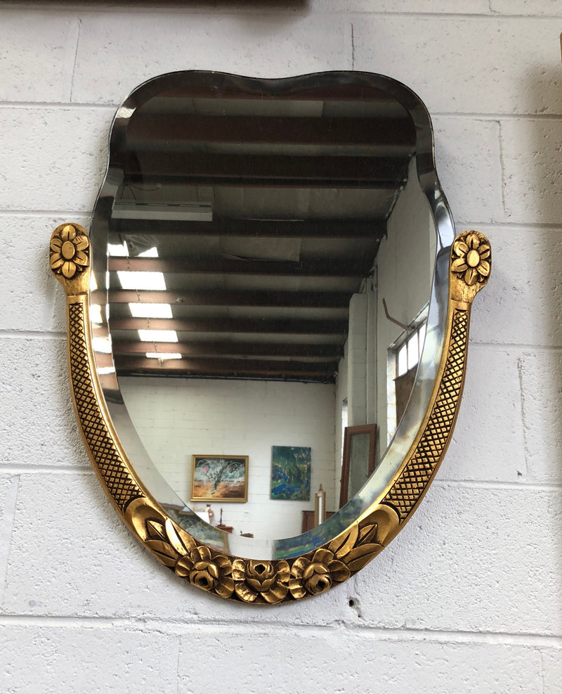 Beautiful French decorative Art Deco giltwood wall mirror with lovely floral detail. Contains its original mirror and is in good original condition.