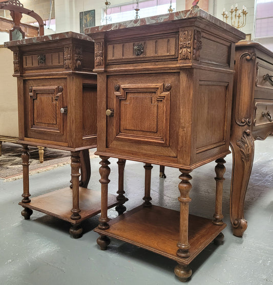Pair French Oak Henry II style rouge marble topped bedside cabinets. Consisting of one drawer, one cupboard and a bottom shelf. Carved decoration and turned legs. Circa: 1900's.