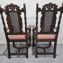 Pair oak Jacobean Revival carver chairs with cane back. In good restored condition with clean upholstery.
