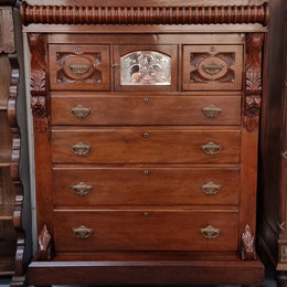 A 19th Century Scottish Mahogany tall boy/ chest of six drawers with small cabinet section at the top. Beautiful carvings and easily comes apart into three sections making transport for moving into place easy. In good original detailed condition.