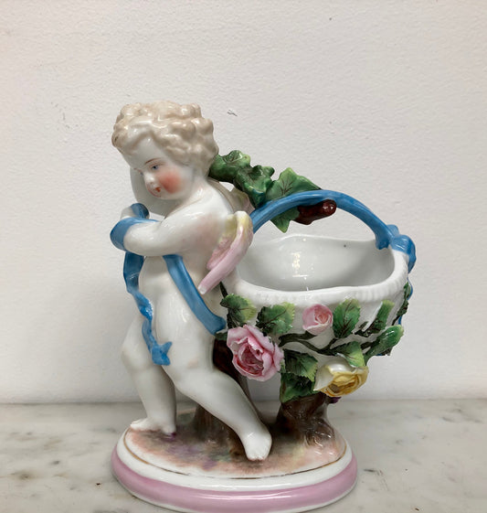 Victorian Ceramic  Figure Of Cupid Carrying A Basket