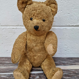 Part of a huge collection is this adorable old Vintage Teddy bear with glass eyes. The growler still works and he is in good original condition.