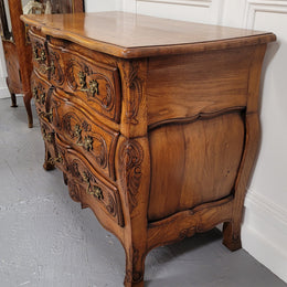 French Antique Louis XIV style Oak wooden top commode. It has a stunning serpentine bombe shape front along with amazing handles and carvings. It comes with three beautiful keys as pictured and comes with working locks. It has been sourced from France and in good original detailed condition.