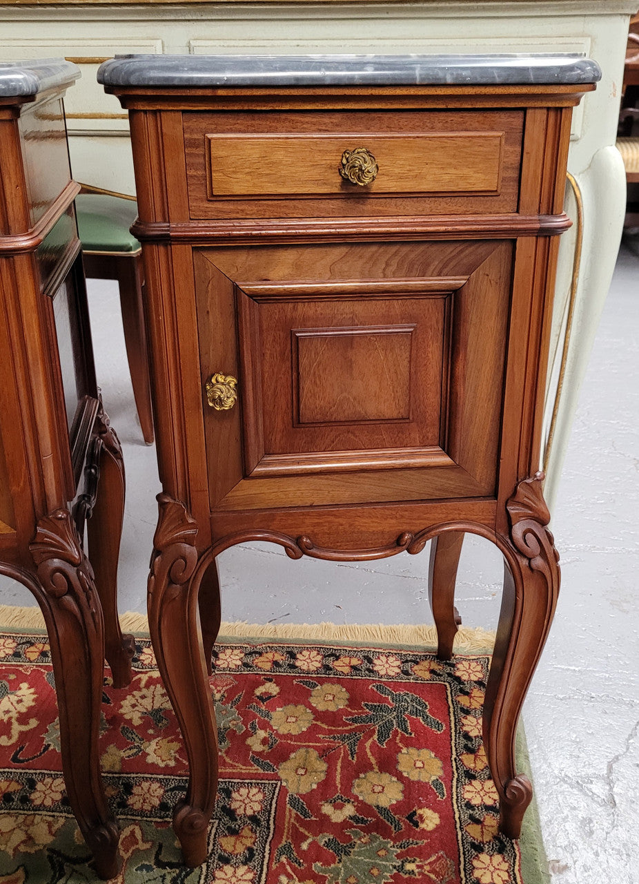 Pair of Walnut Louis XV style grey marble top bedside cabinets. Single drawer, one cupboard and lovely French cabriole legs. They have been sourced from France and are in good original condition.
