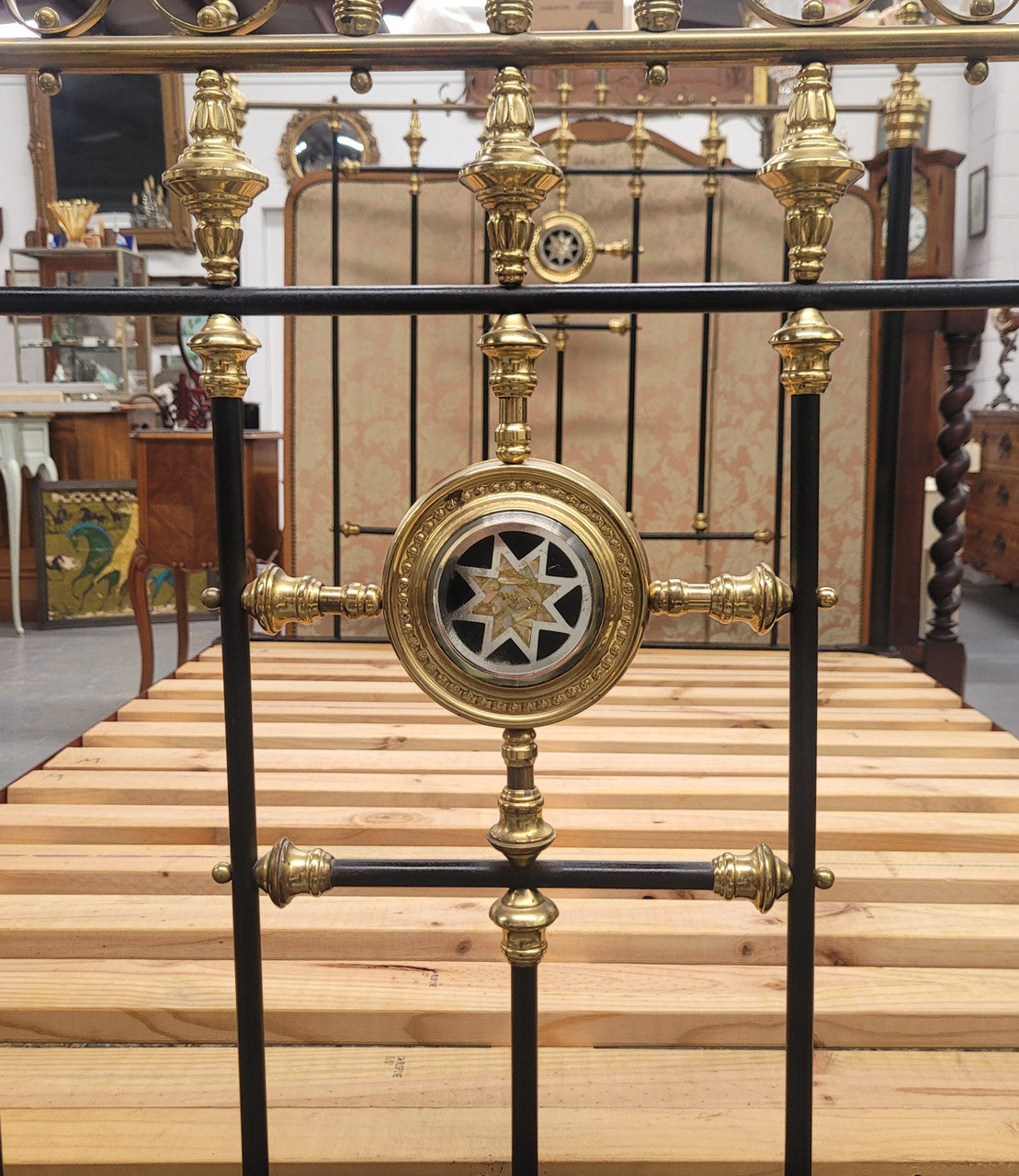 Rare Antique cast iron and brass Victorian queen size bed. Comes with custom made slats.  It has been sourced locally and is in good original condition.