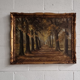 French signed oil on canvas depicting a charming landscape scene in a decorative gilt frame. It is in good original detailed condition and has been sourced from France.