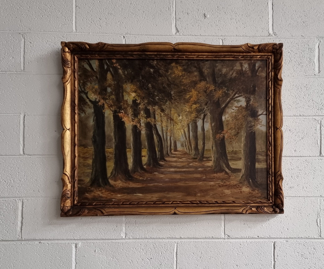 French signed oil on canvas depicting a charming landscape scene in a decorative gilt frame. It is in good original detailed condition and has been sourced from France.