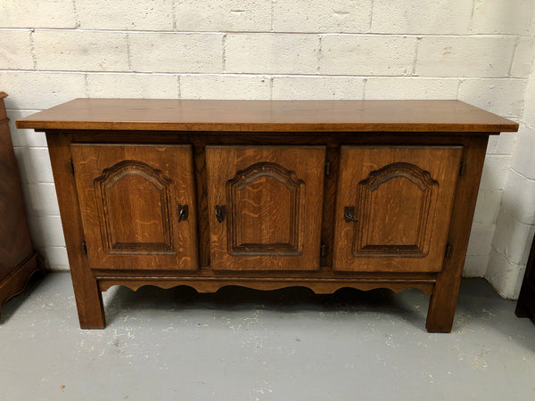 Solid and rustic French oak three door cabinet with plenty of room for storage and all doors lock with heavy duty iron keys.