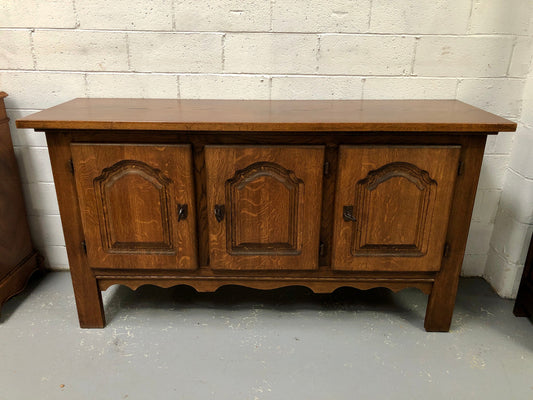 Solid and rustic French oak three door cabinet with plenty of room for storage and all doors lock with heavy duty iron keys.