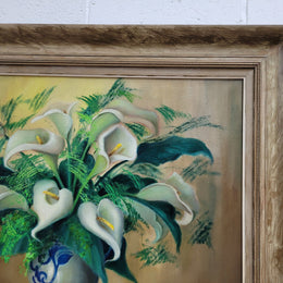 Signed and sourced in France a vintage oil on board still life of white lillie's in vase. In a beauitufl frame and it is in good original detailed condition.