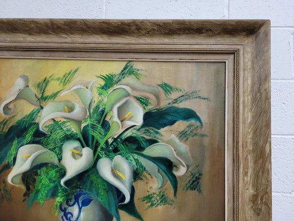 Signed and sourced in France a vintage oil on board still life of white lillie's in vase. In a beauitufl frame and it is in good original detailed condition.