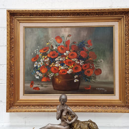 Lovely Vintage signed floral oil on canvas of Poppies and Daisy's and in a decorative gilt frame . In good original detailed condition.