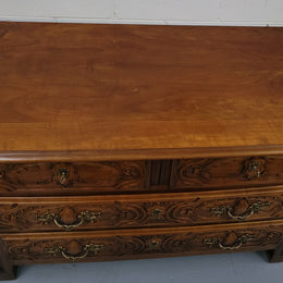 French Cherrywood Louis XIV style wooden topped chest of four drawers. It has been sourced from France and is in good original detailed condition.