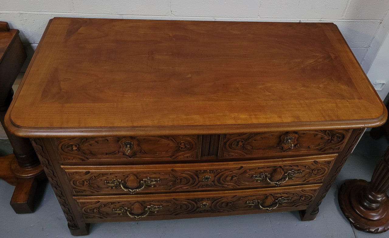 French Cherrywood Louis XIV style wooden topped chest of four drawers. It has been sourced from France and is in good original detailed condition.