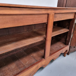 Early 19th Century Louis XV style Fruitwood three door sideboard. It has three hidden internal drawers and one of them has green valet and small sections for cutlery. It is in good restored condition.