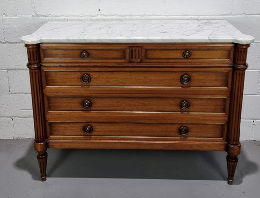 Beautiful French Louis XV Style Marble top five drawer commode. There are five drawers and it has a lovely brass inlay. It is in good original detailed condition.