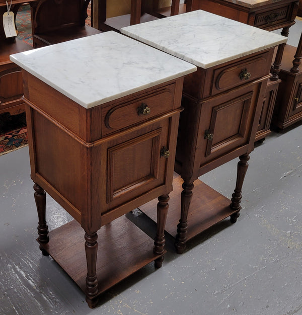 Antique French Oak Henry II white marble top bedside cabinets. They have one drawer and cupboard a long with an open shelf at the bottom. Sourced from France and in good original detailed condition.