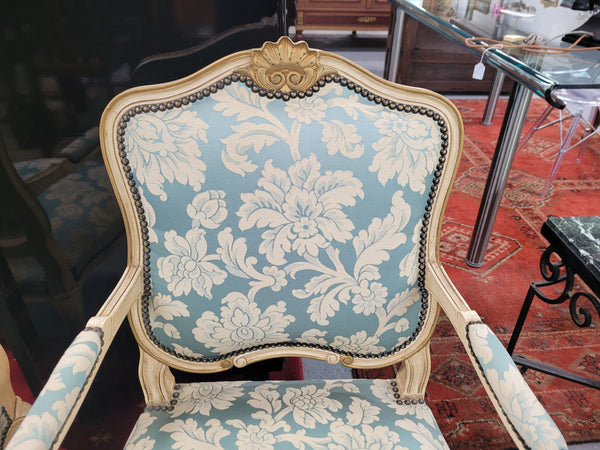 A beautiful pair of French upholstered Louis XV painted style armchairs, with lovely carved detail and they are very comfortable to sit in. These chairs are in great original condition.