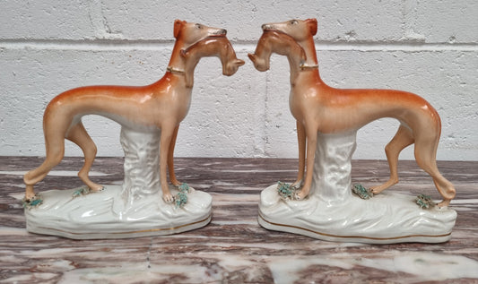 Superb pair of Staffordshire Pottery Greyhounds both with rabbits/hares in their mouths. In good original condition with no cracks or chips, please view photos as they help form part of the description.