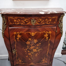 Stunning French Transitional style Mahogany marquetry inlay salon cabinet in the bombe shape. It has one draw, one shelf, marble top & ormolu decoration. Sourced from France and in good original detailed condition.