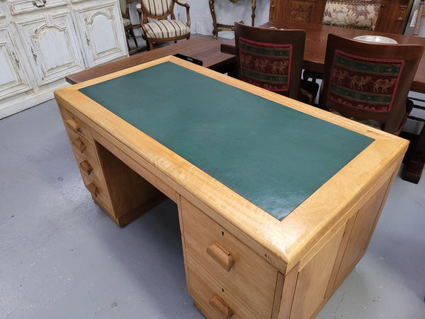 Parliament house desk made from Queensland maple. Desk has room numbers stamped to front. It's in good original condition. Purchased from a sale in old Parliament House in the late 1980's.