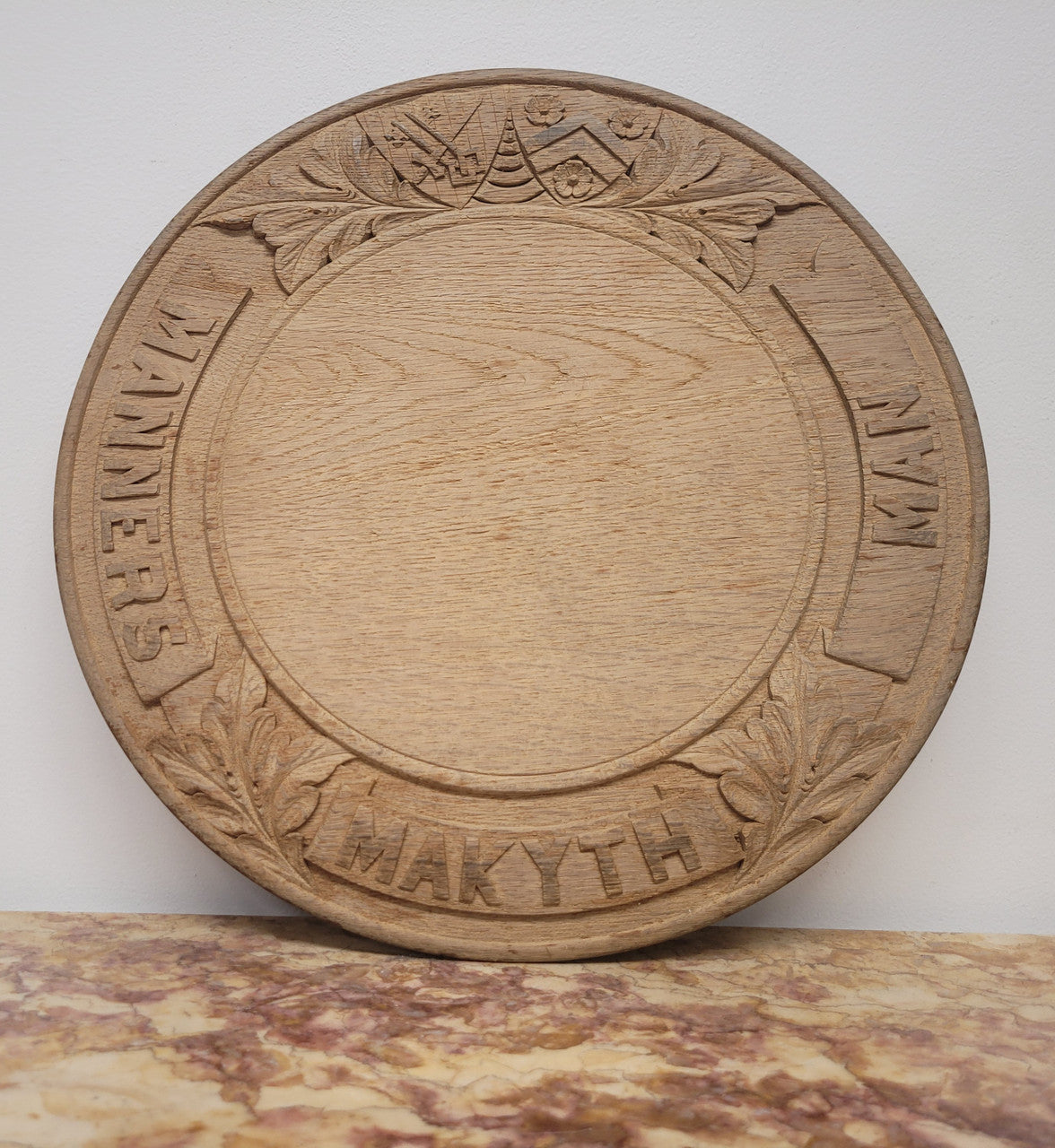 Antique Circular Oak Bread Board Carved with “Manners Makyth Man” & the Arms of Winchester College England