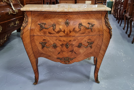 Fabulous French petite inlaid two drawer commode with ormolu mounts and lovely marble top. It is in good original detailed condition.