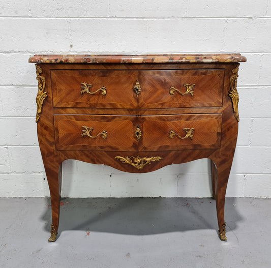 High quality French Mahogany Louis XVth style marble top commode. It has an eye catching marble top and is signed on body "J Bamelis". In very good original detailed condition.