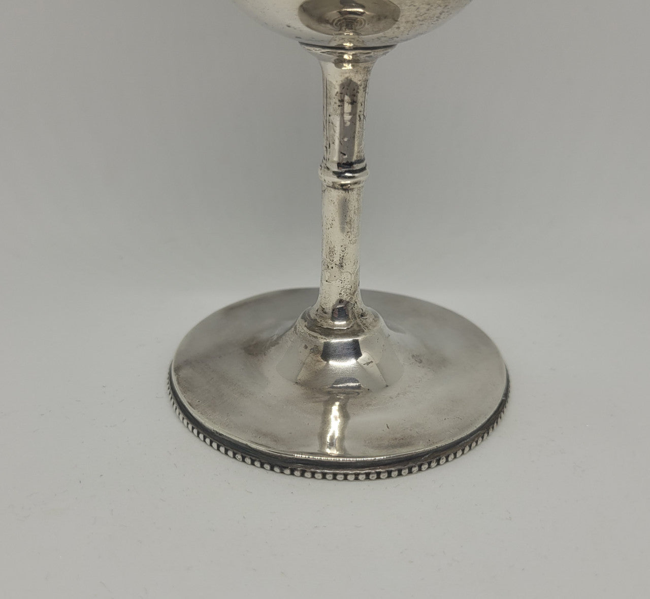Unique Sterling Silver Christening Goblet With Repousse Motifs. Sheffield 1891. In very good original condition. Initials CJOB on one panel.