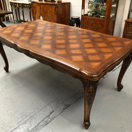 High quality French Oak Louis XV Style, beautifully carved extension table. It has an amazing parquetry top and when fully extended measures to 3 meters long. In very good original detailed condition.