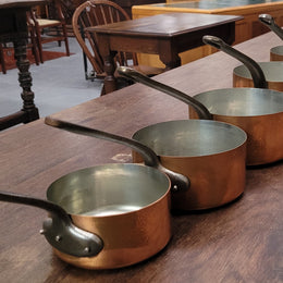 Set of five copper sauce pans with foundry stamp. They have been sourced from France and are in good original detailed condition.