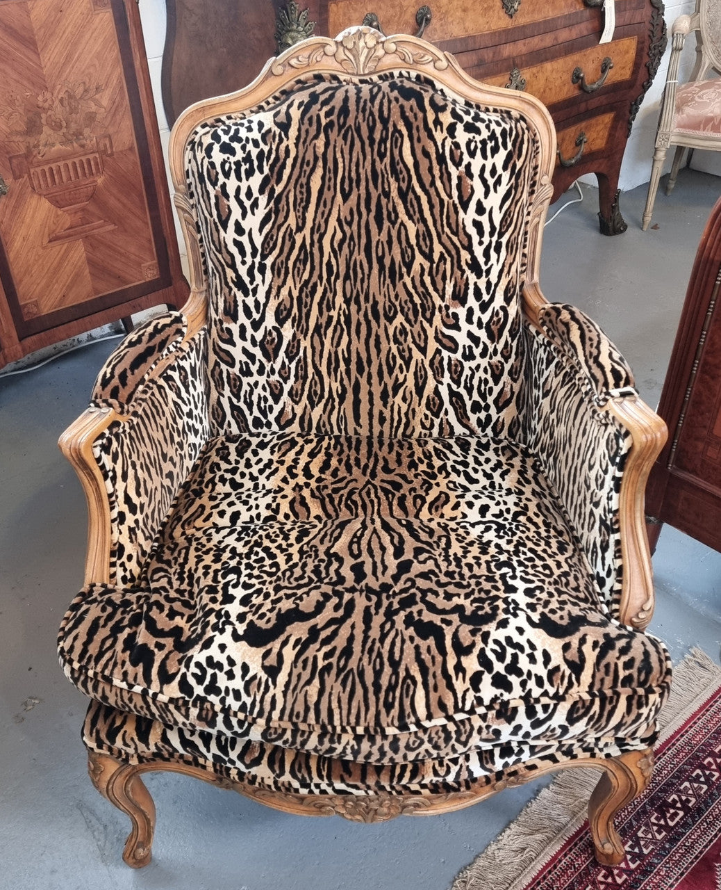 A French Louis XV style Armchair With Leopard Print Upholstery With Matched Footstool