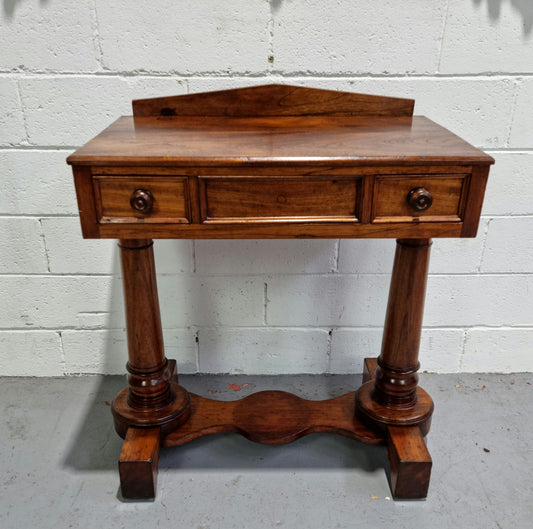 William IV style console table or could be used as a desk. It has two small drawers either side and is ideal for small areas like a unit or apartment. It is very sturdy and is in good original detailed condition.