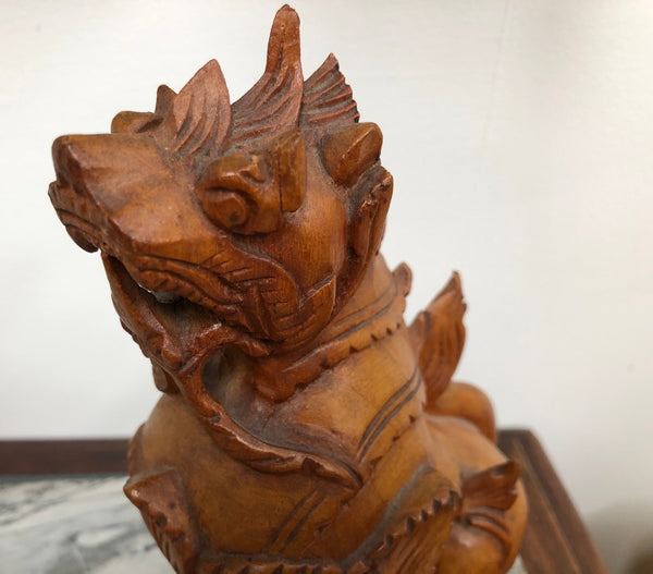 Chinese carved Teak Foo dog with very good detail. In good original condition.