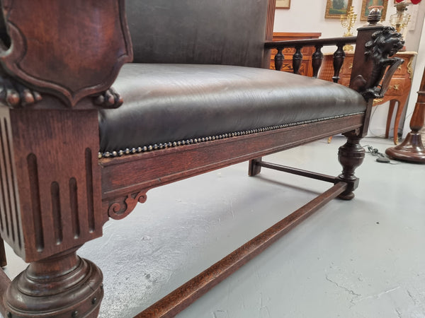 Superbly carved early 19th century newly upholstered French Oak hall seat of grand proportions and lovely details in good condition.